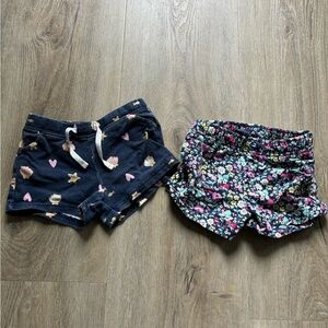 2 Carters 3T shorts. Shells pattern and floral pattern